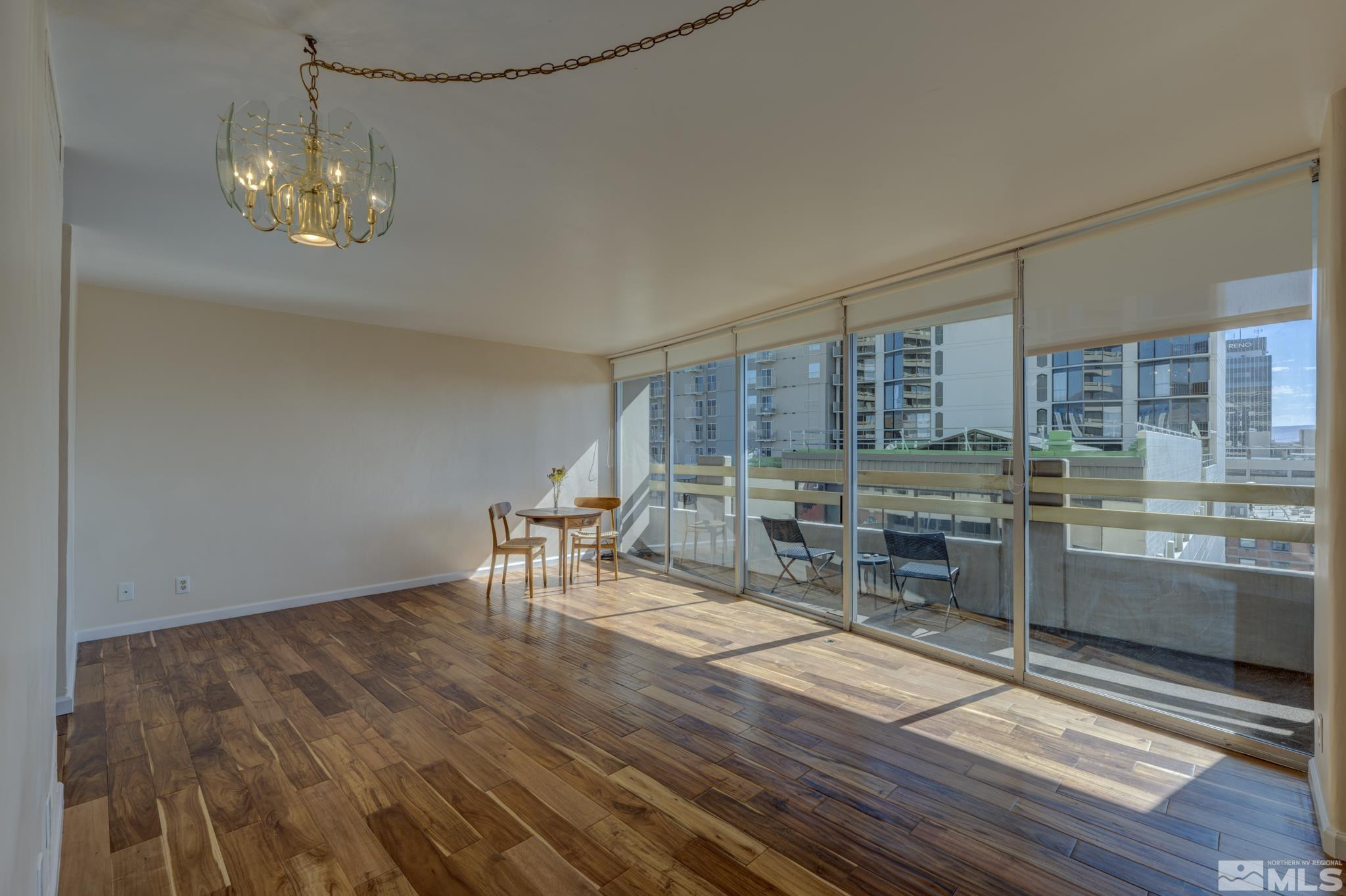 100 North Arlington Avenue, Unit 6B Reno, NV 89501 - Photo 4 of 23 a dining room with furniture and window