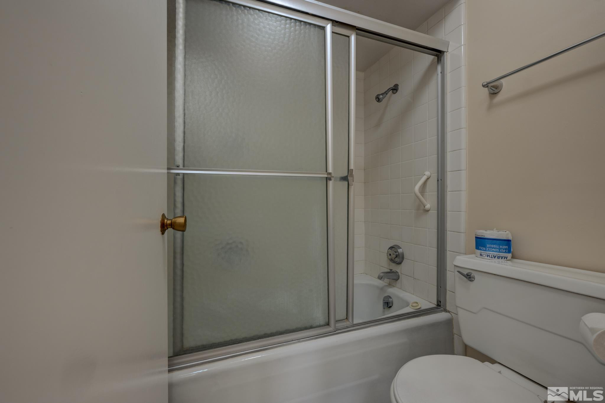 100 North Arlington Avenue, Unit 6B Reno, NV 89501 - Photo 8 of 23 a bathroom with a shower and a toilet
