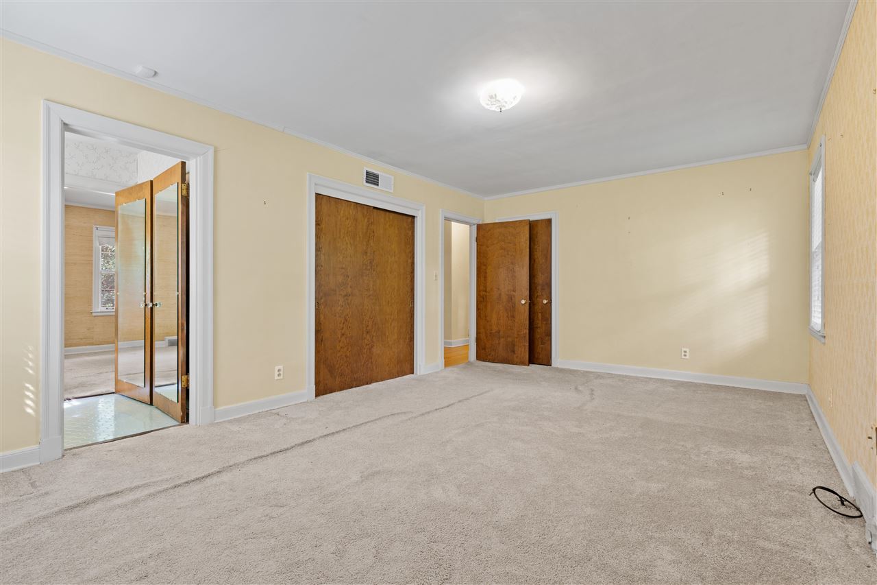 4810 Shady Grove Road Memphis, TN 38117 - Photo 14 of 20 Bedroom 2 also measures 19x12 with Hardwood under the Carpet, Double Closet + Single Closet