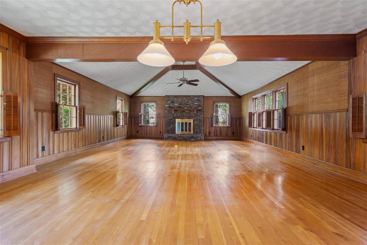 4810 Shady Grove Road Memphis, TN 38117 - Photo 7 of 20 FABULOUS 21x20 Den with 10 ft Wood-Beamed Ceiling, Fireplace with Raised Brick Hearth and Paneled Walls