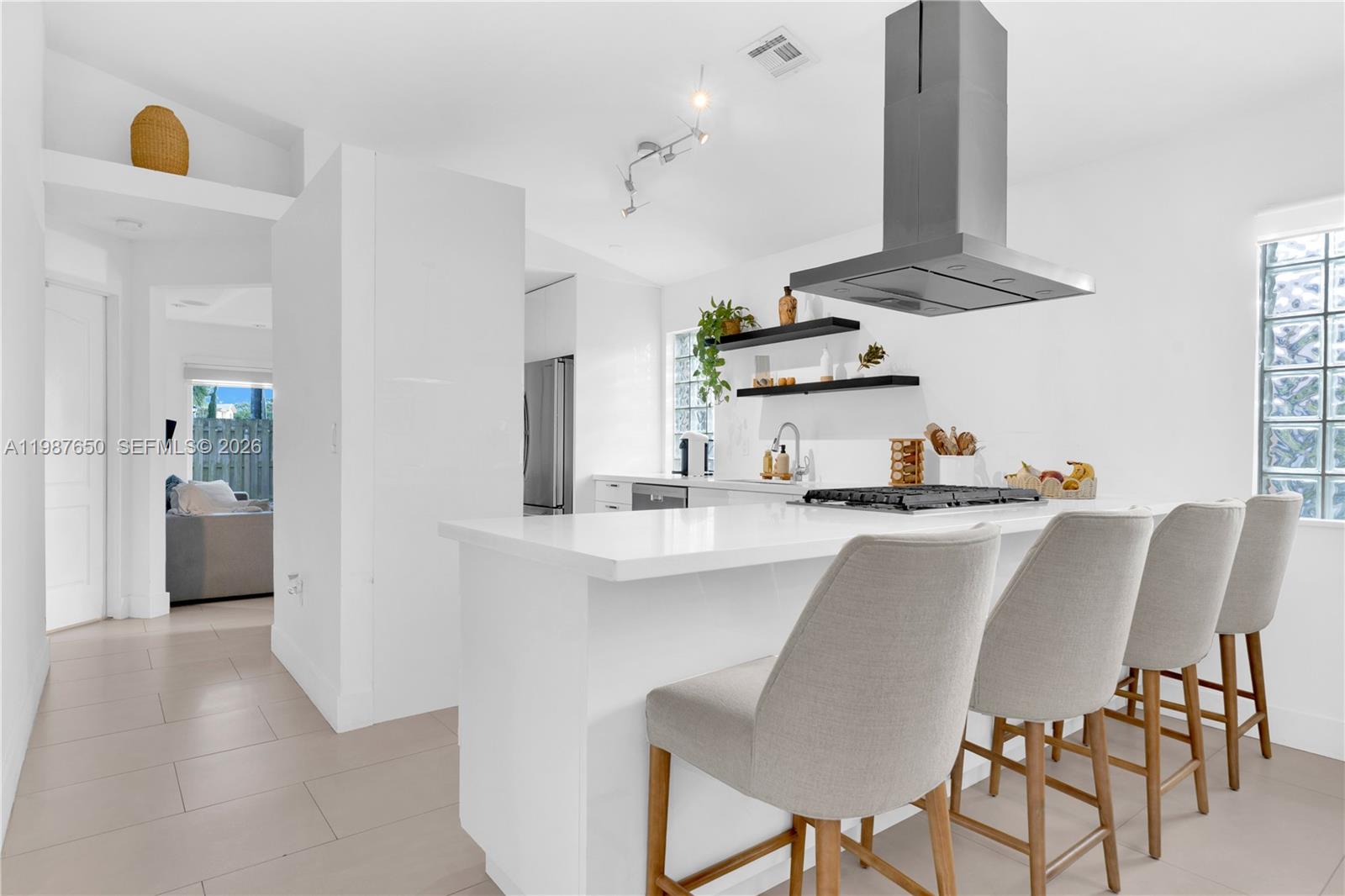 8858 Southwest 214th Street Cutler Bay, FL 33189 - Photo 11 of 41 a dining room with furniture and window