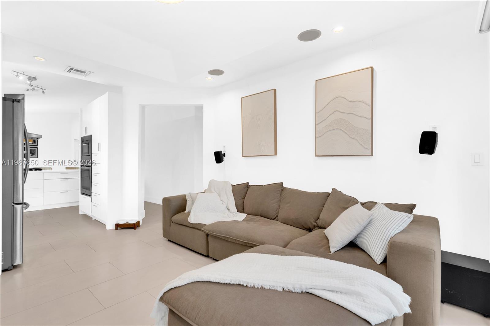 8858 Southwest 214th Street Cutler Bay, FL 33189 - Photo 21 of 41 a living room with furniture and a large window