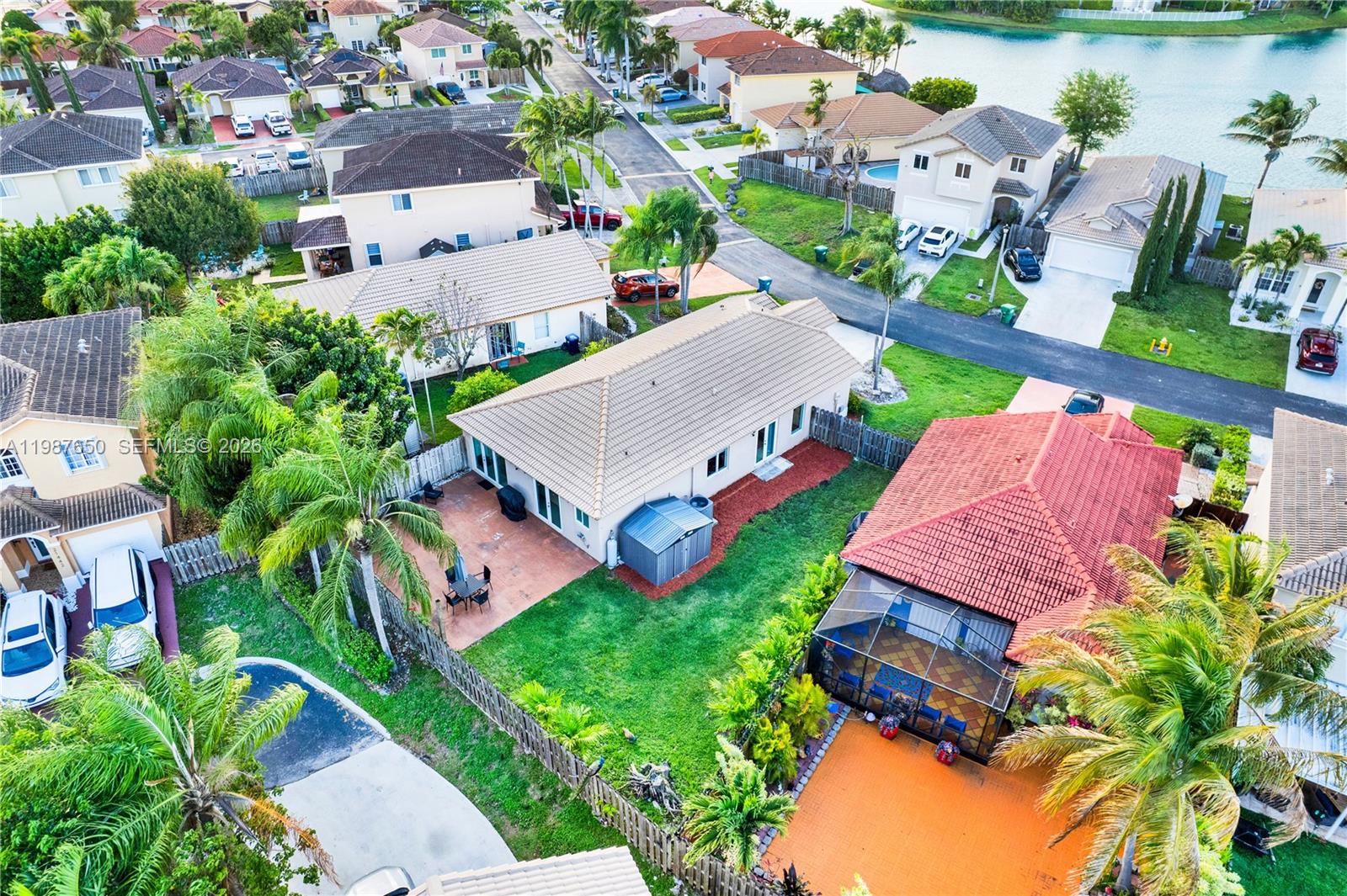 8858 Southwest 214th Street Cutler Bay, FL 33189 - Photo 40 of 41 an aerial view of multiple houses with yard