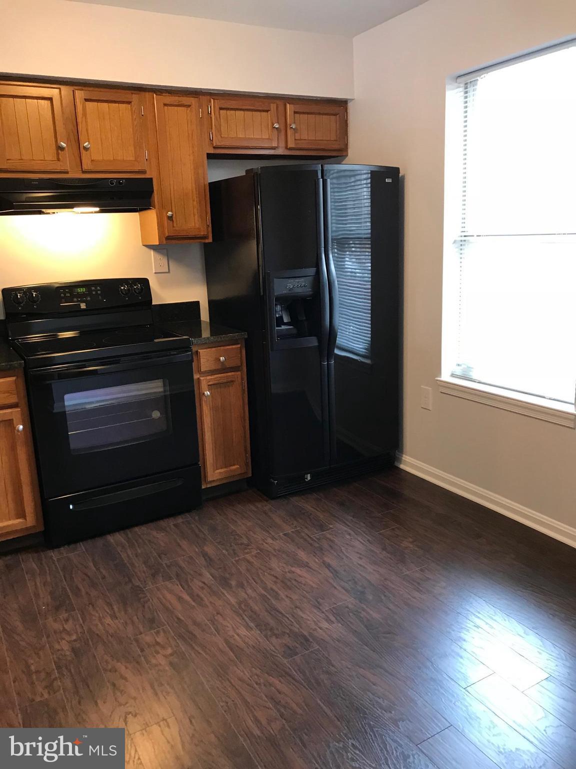 3004 Shepperton Terrace Silver Spring, MD 20904 - Photo 13 of 22 New floor, oven, granite, sink, faucet, etc.