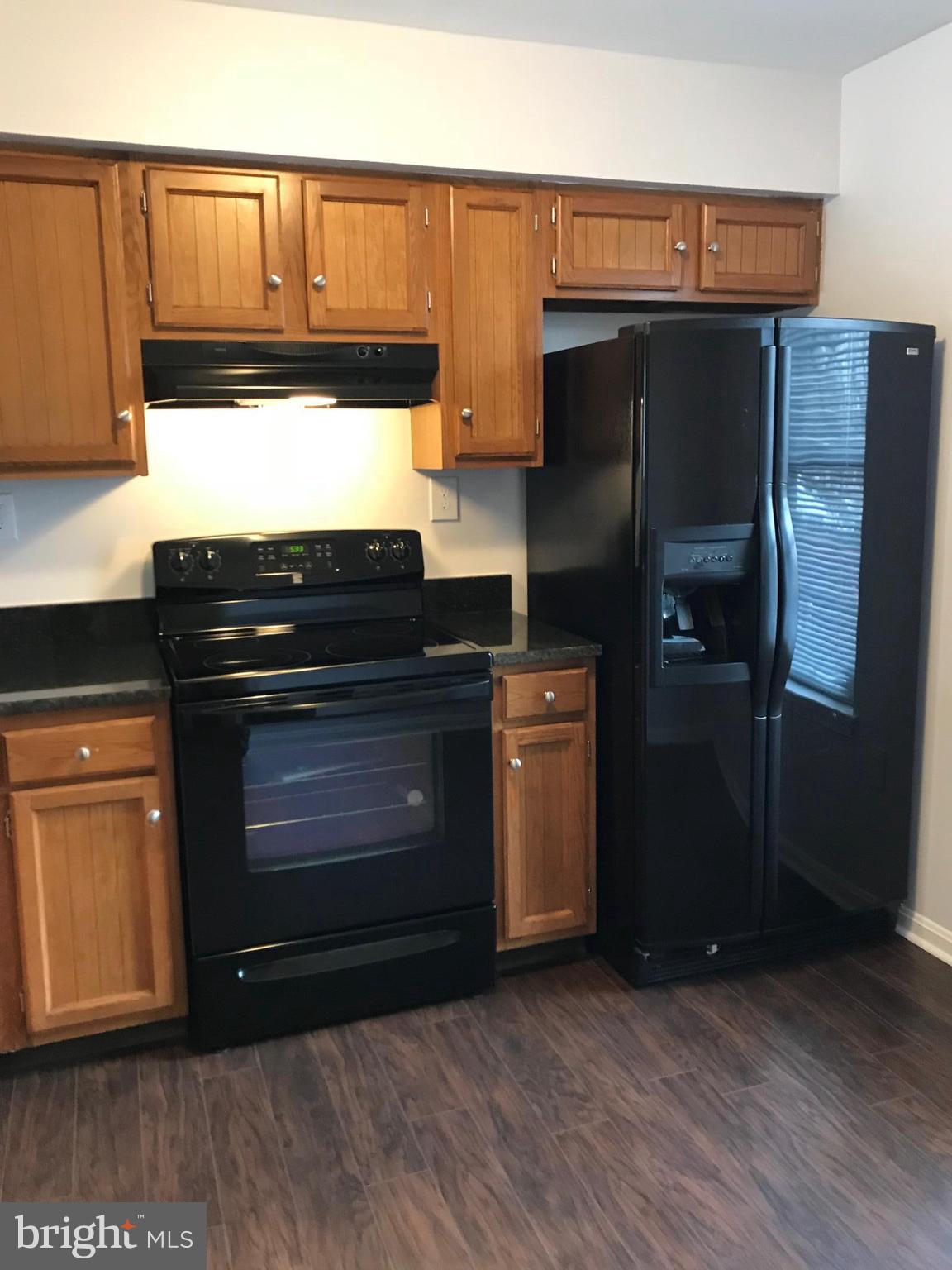 3004 Shepperton Terrace Silver Spring, MD 20904 - Photo 10 of 22 New oven, new flooring! Window & table space.