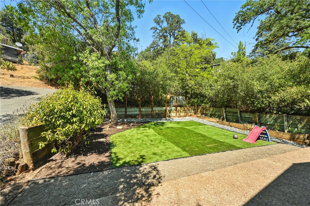 3171 Springe Street Nice, CA 95464 - Photo 18 of 28 a view of a backyard with a garden