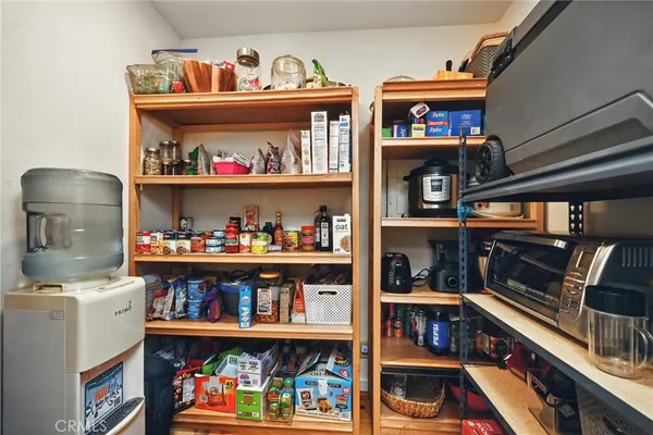 a room with storage and a book shelf