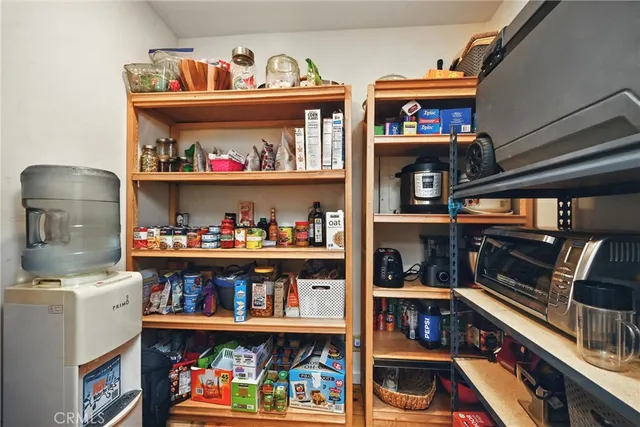 a room with storage and a book shelf