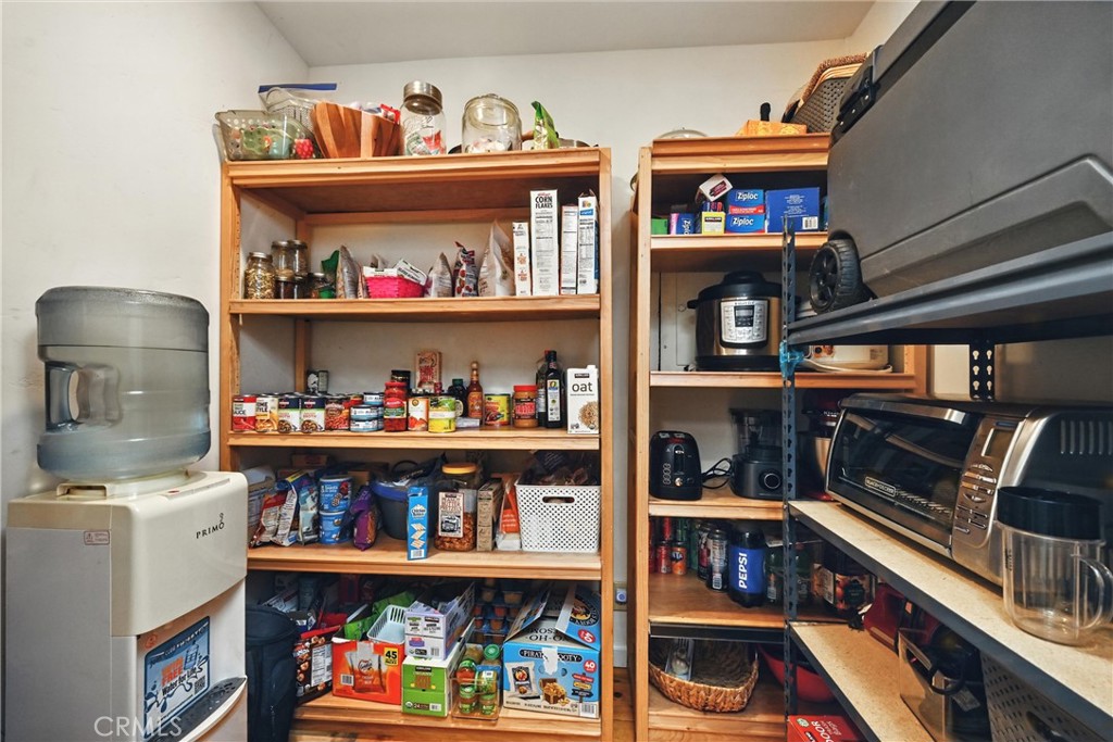 3171 Springe Street Nice, CA 95464 - Photo 5 of 28 a room with storage and a book shelf
