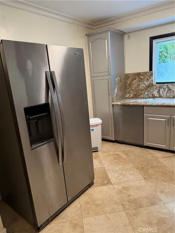 a kitchen with stainless steel appliances a refrigerator and a sink