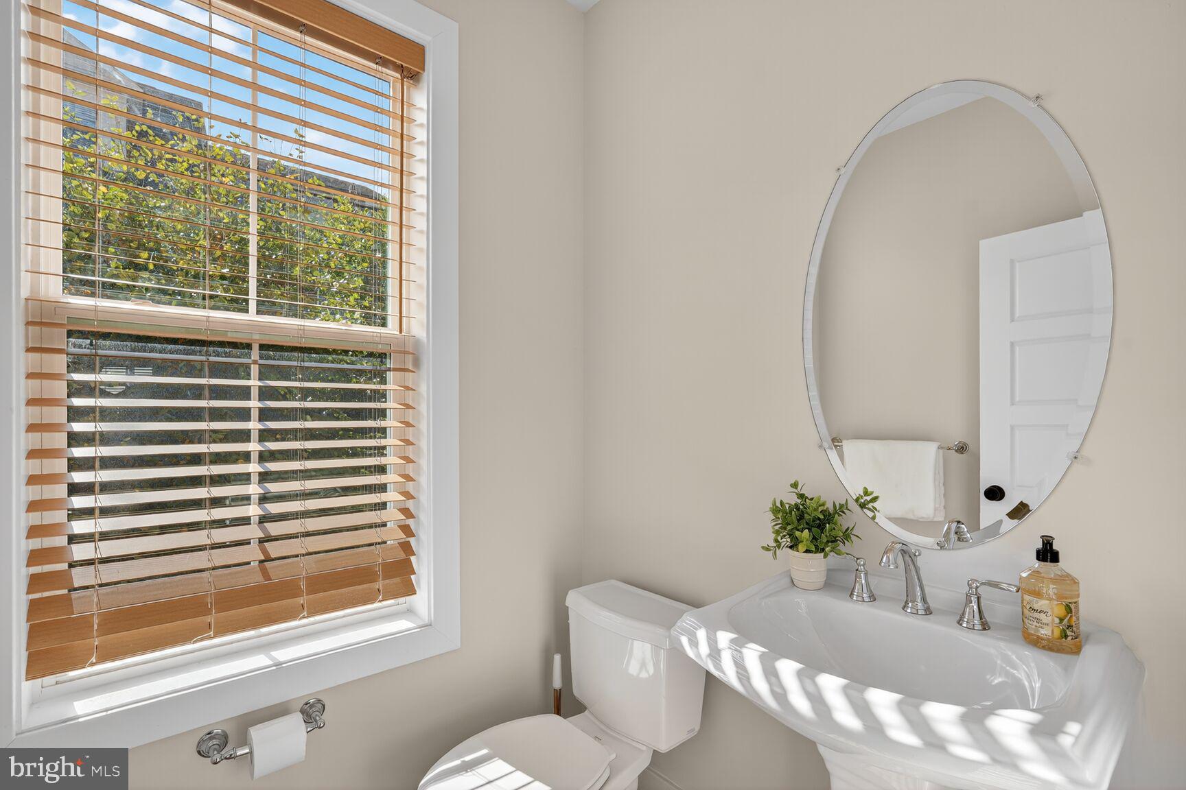 2373 Wyeth Street Silver Spring, MD 20906 - Photo 12 of 32 a dining room with furniture and a potted plant
