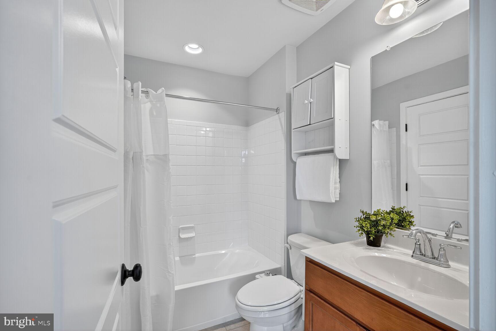 2373 Wyeth Street Silver Spring, MD 20906 - Photo 25 of 32 a bathroom with a sink a toilet and shower