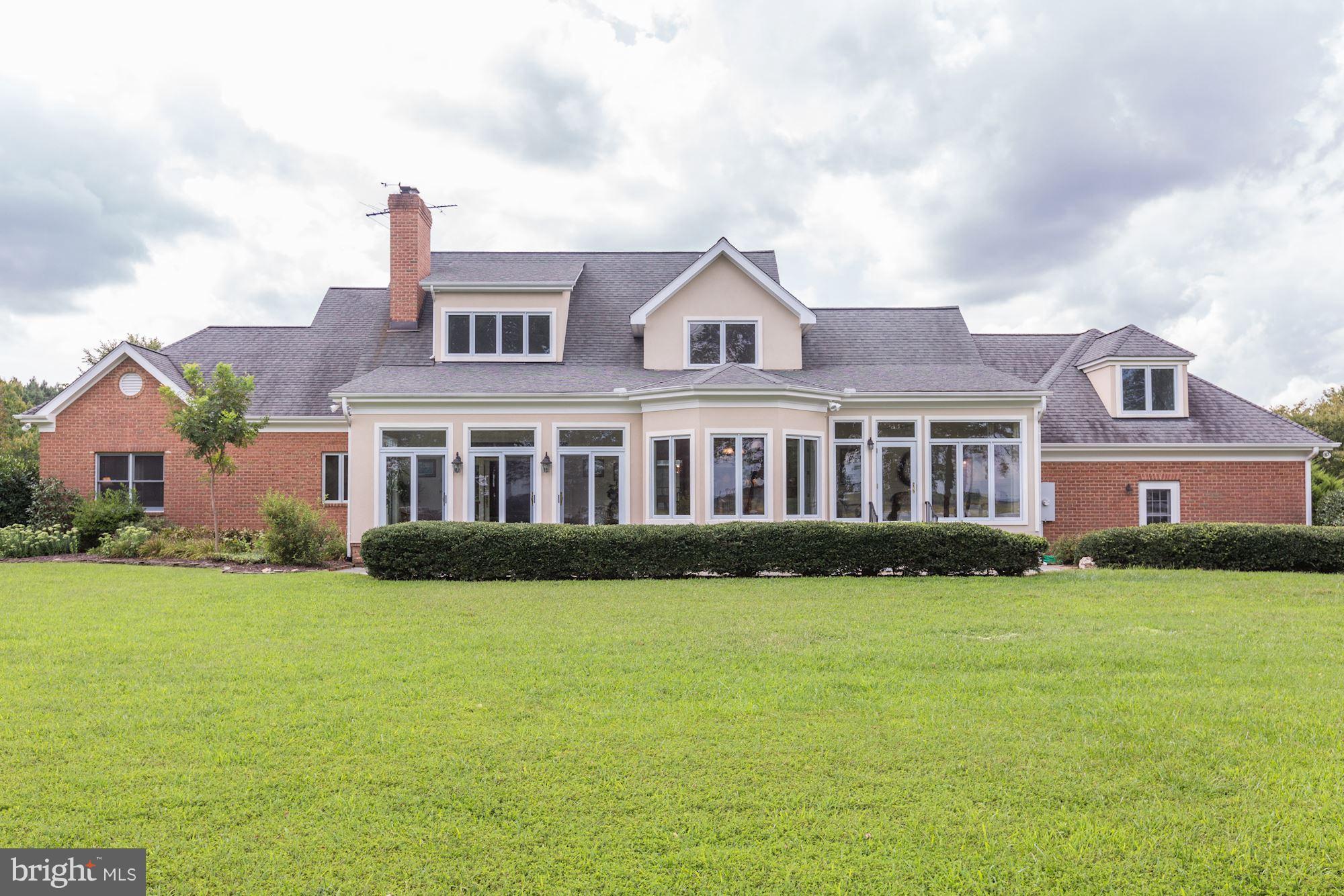 31780 Windy River Road Trappe, MD 21673 - Photo 27 of 30 Expansive windows waterside of home