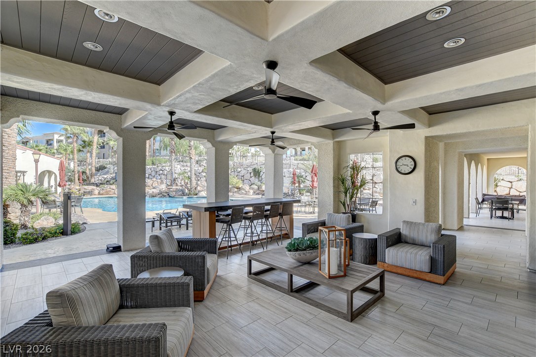 2555 Hampton Road, Unit 2207 Henderson, NV 89052 - Photo 52 of 74 An inviting covered patio offers a bar, comfortable seating, and refreshing pool views.