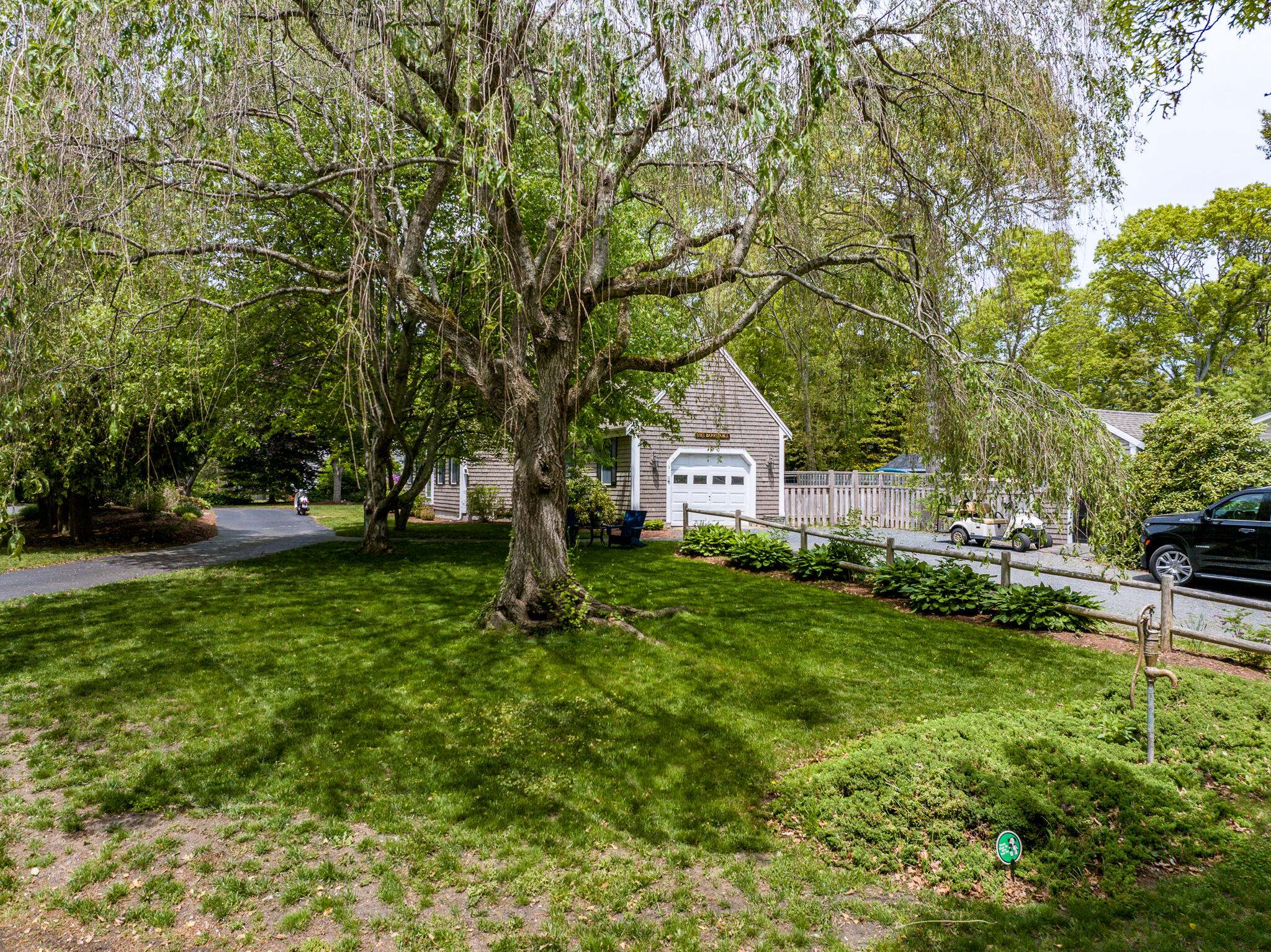61 Angus Way Centerville, MA 02632 - Photo 52 of 59 a front view of a house with garden