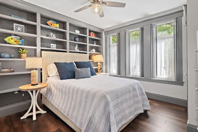 a bedroom with a bed furniture and a window