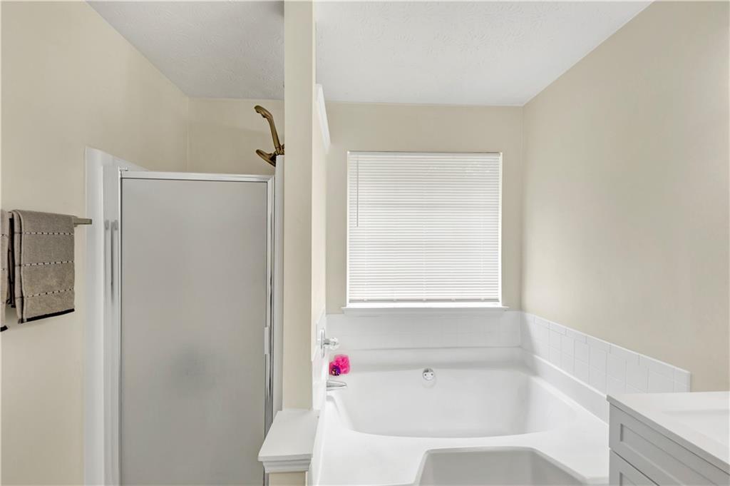 2880 Field Spring Drive Lithonia, GA 30058 - Photo 28 of 31 a white bath tub sitting next to a white sink