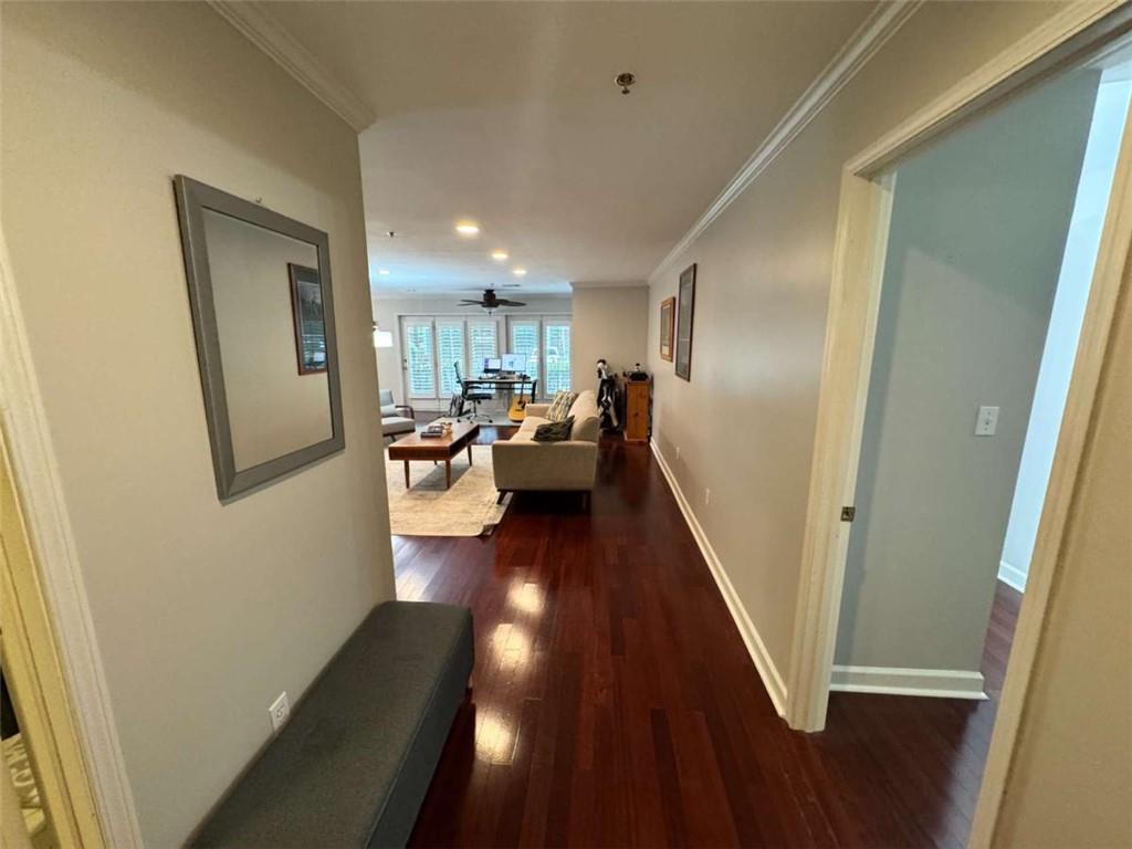 3201 Lenox Road Northeast, Unit 2 Atlanta, GA 30324 - Photo 2 of 39 a view of a hallway with furniture and wooden floor