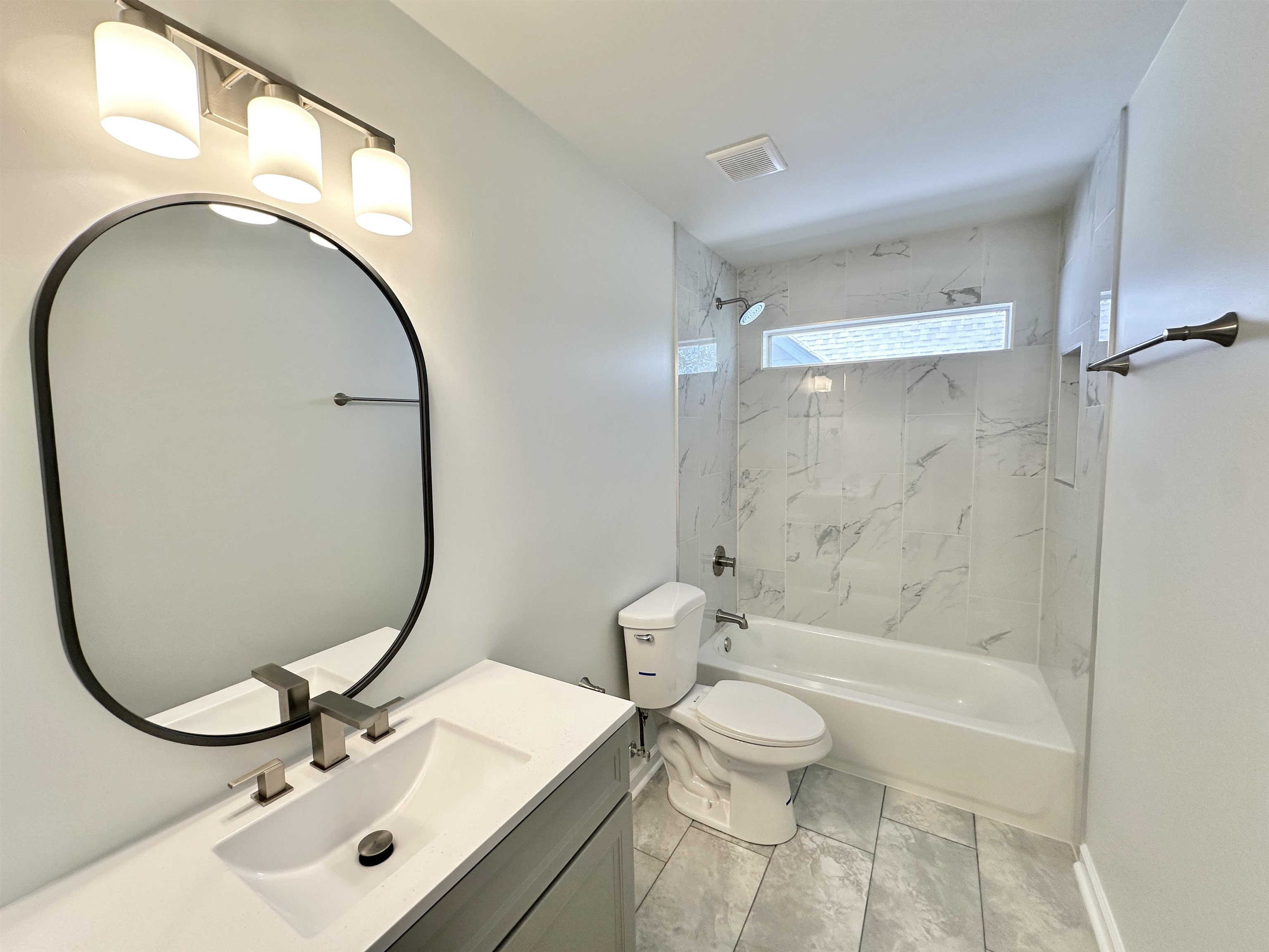 10006 Cameron Ridge Trail Memphis, TN 38016 - Photo 24 of 29 a bathroom with a sink mirror bathtub and toilet
