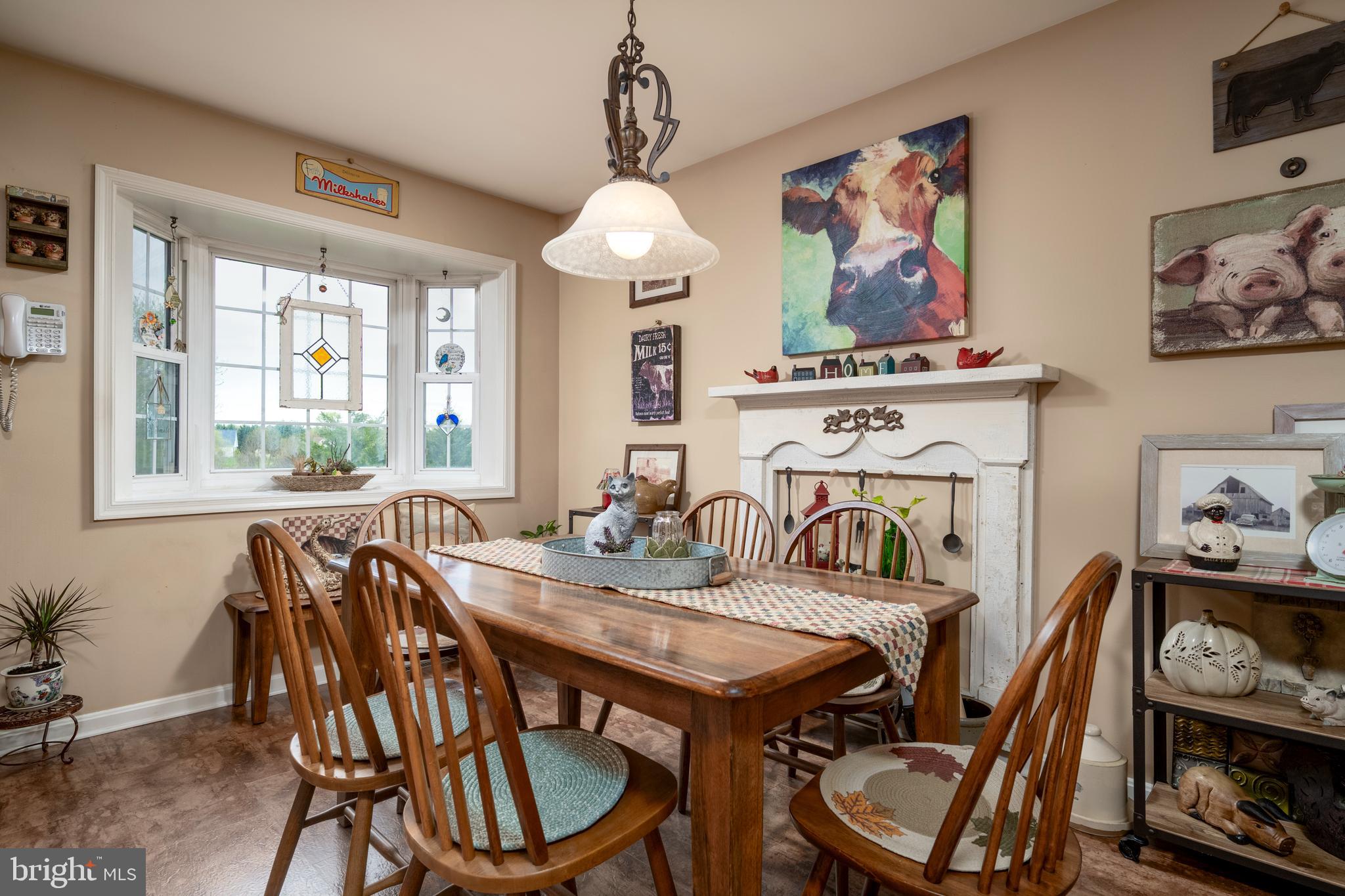 65 Susannah Drive Magnolia, DE 19962 - Photo 11 of 31 a view of a dining room with furniture window and wooden floor