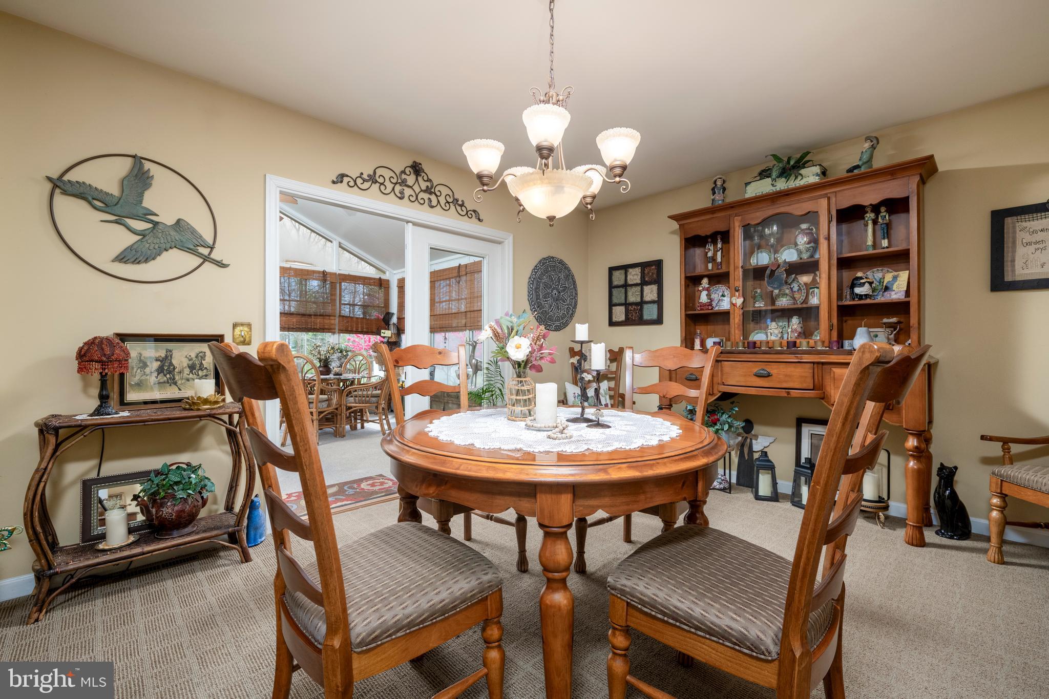 65 Susannah Drive Magnolia, DE 19962 - Photo 13 of 31 a view of a dining room with furniture and a chandelier