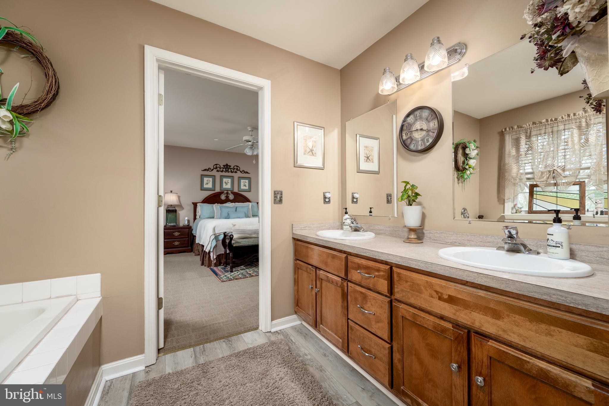 65 Susannah Drive Magnolia, DE 19962 - Photo 16 of 31 a en suite bathroom with a double vanity sink and a mirror