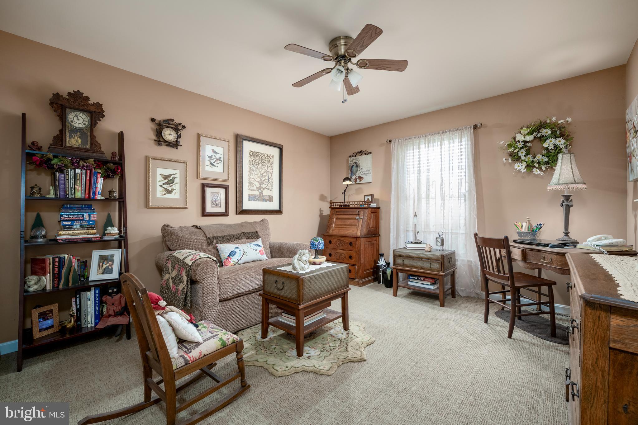 65 Susannah Drive Magnolia, DE 19962 - Photo 20 of 31 a living room with furniture a window and a bookshelf