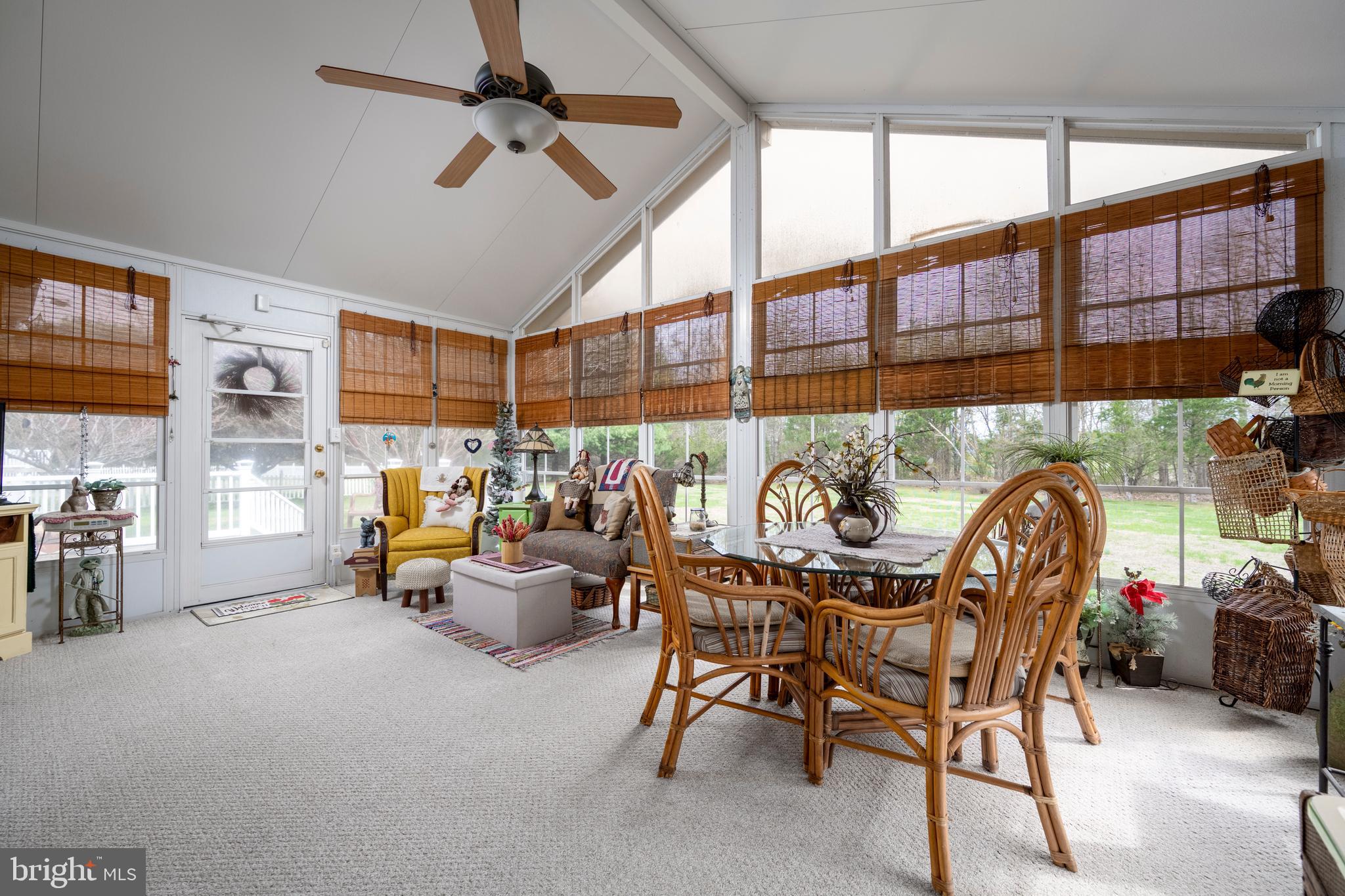 65 Susannah Drive Magnolia, DE 19962 - Photo 22 of 31 a living room with furniture a fireplace and a chandelier