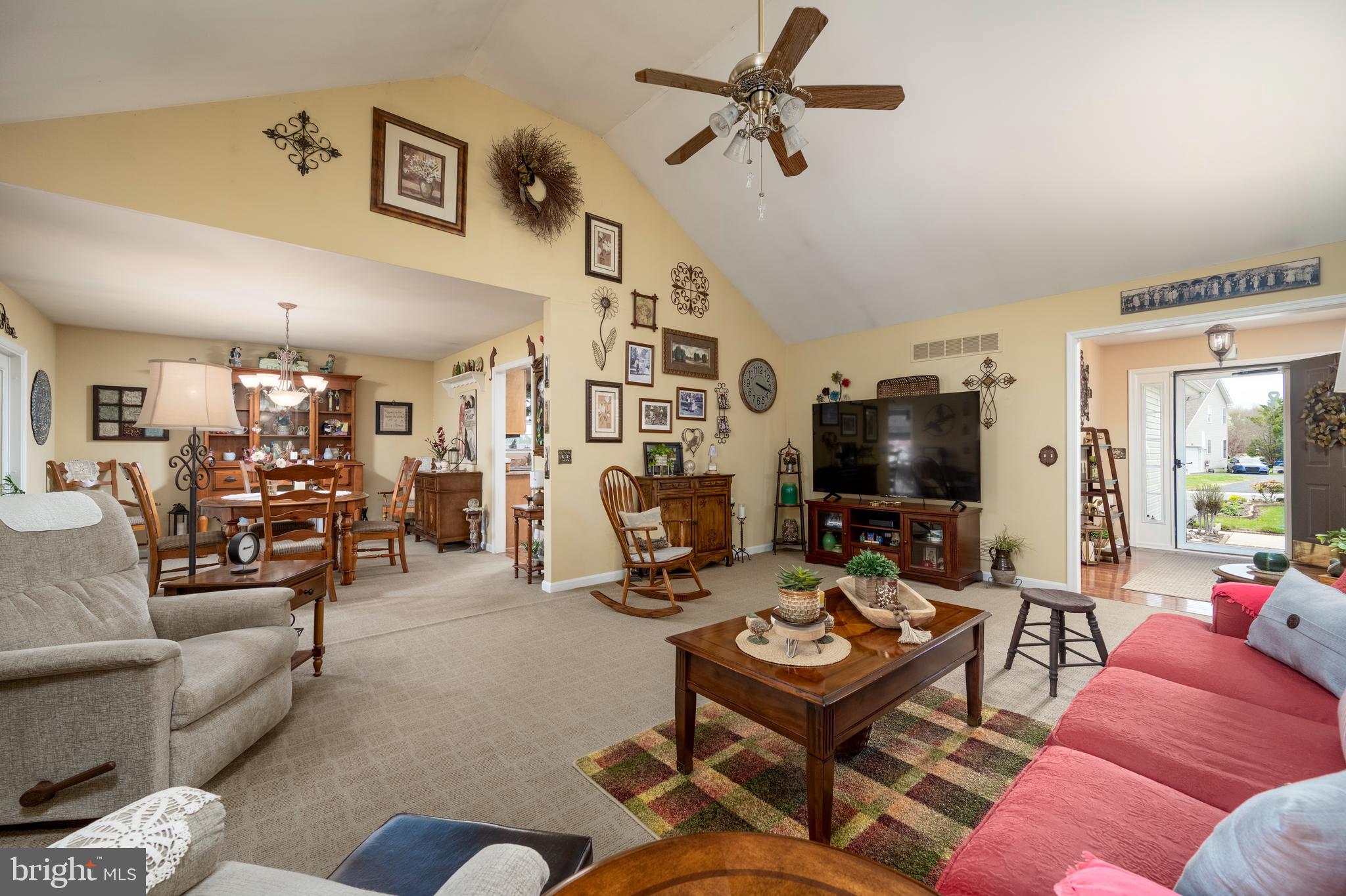 65 Susannah Drive Magnolia, DE 19962 - Photo 6 of 31 a living room with furniture a flat screen tv and a table