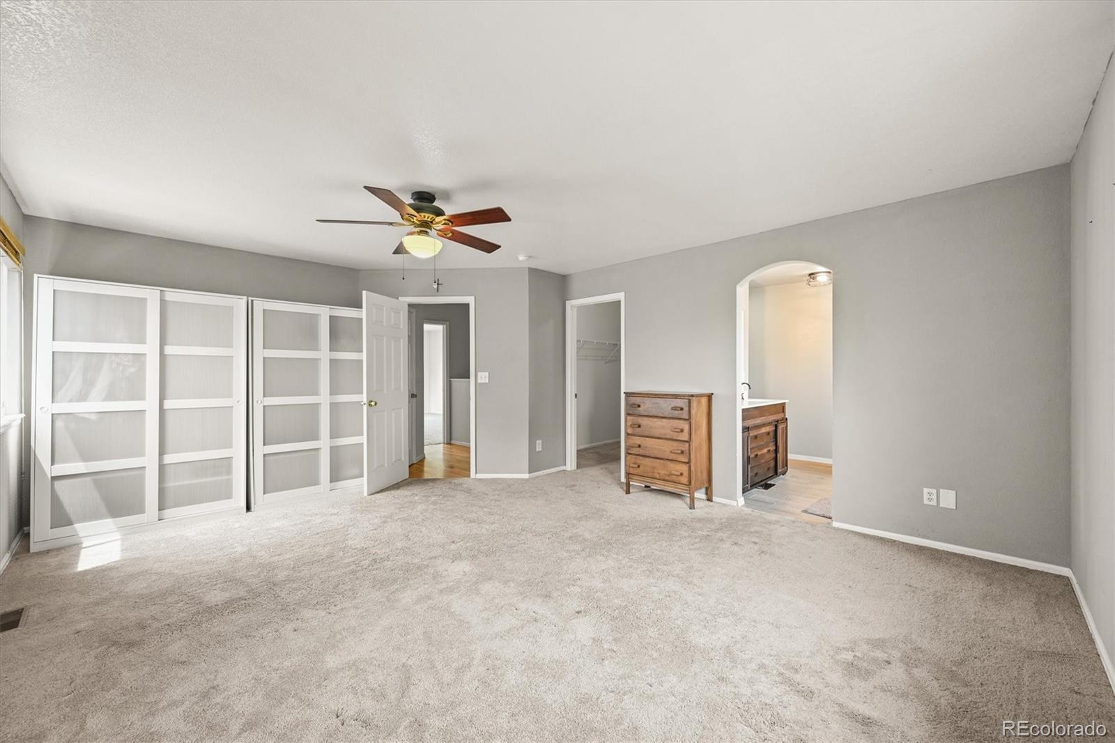 4452 Cornish Way Denver, CO 80239 - Photo 27 of 50 an empty room with closet and windows