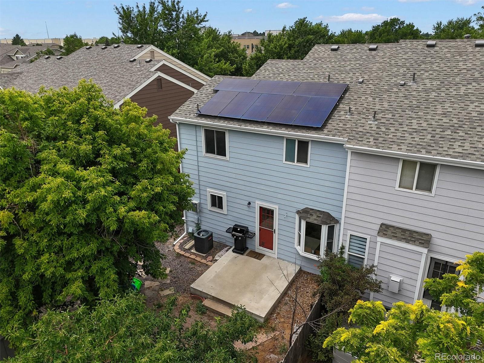 4452 Cornish Way Denver, CO 80239 - Photo 47 of 50 a aerial view of a house with a yard and potted plants