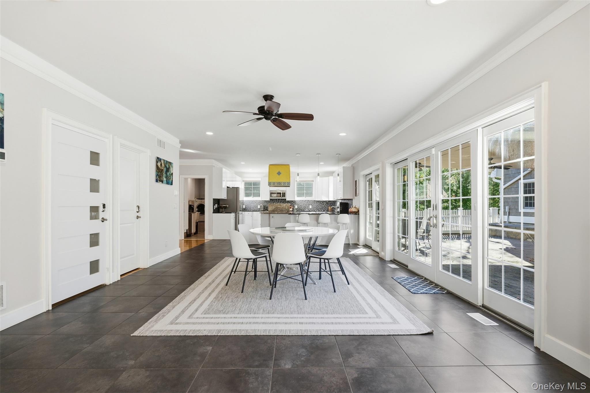 33 A Newtown Road Hampton Bays, NY 11946 - Photo 27 of 50 Dining area with crown molding, a ceiling fan, and recessed lighting