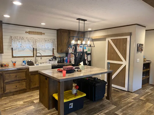 a kitchen that has a lot of cabinets in it