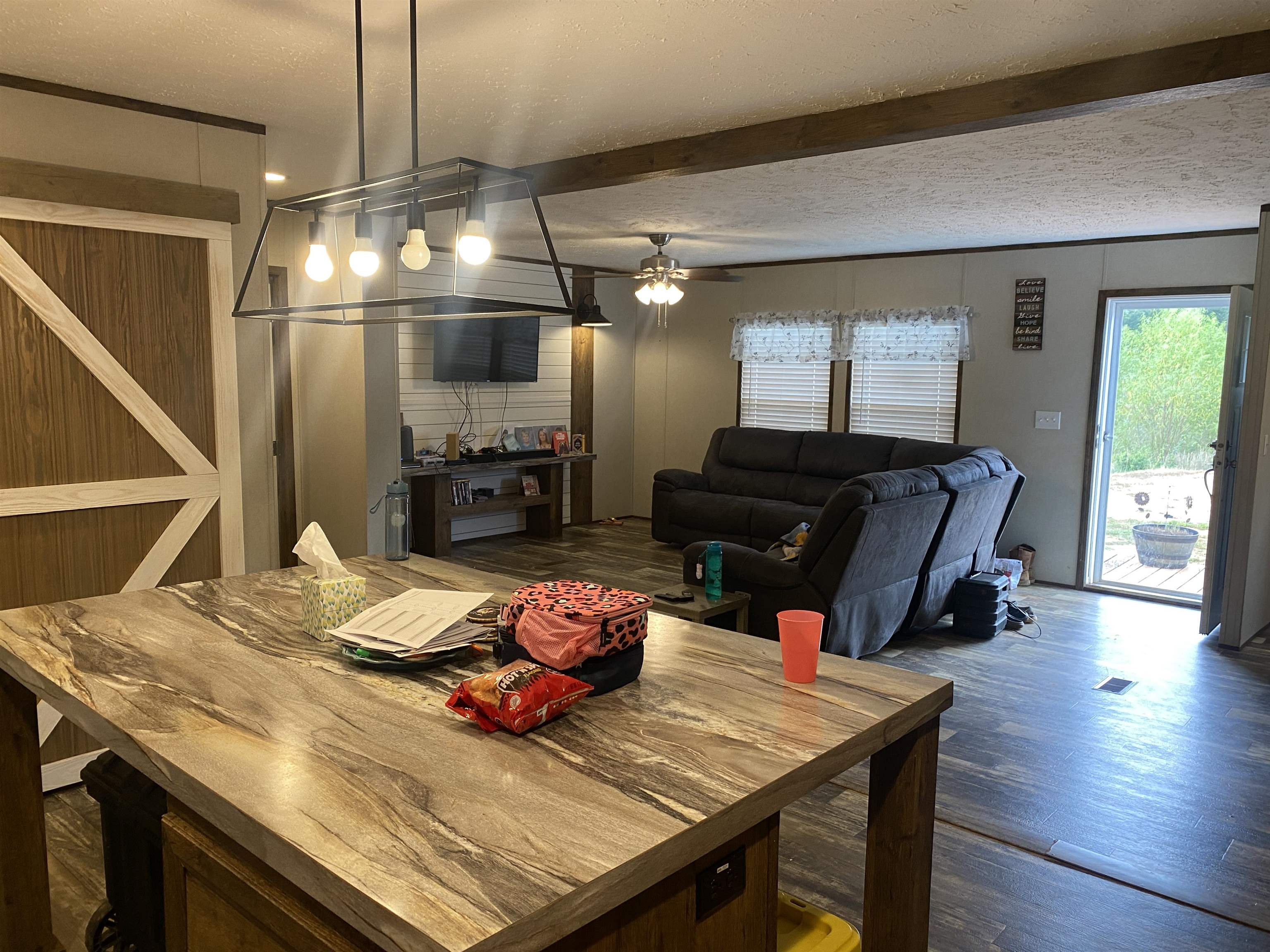 525 Sewell Bottom Road Adamsville, TN 38310 - Photo 15 of 37 a view of a dining room with furniture