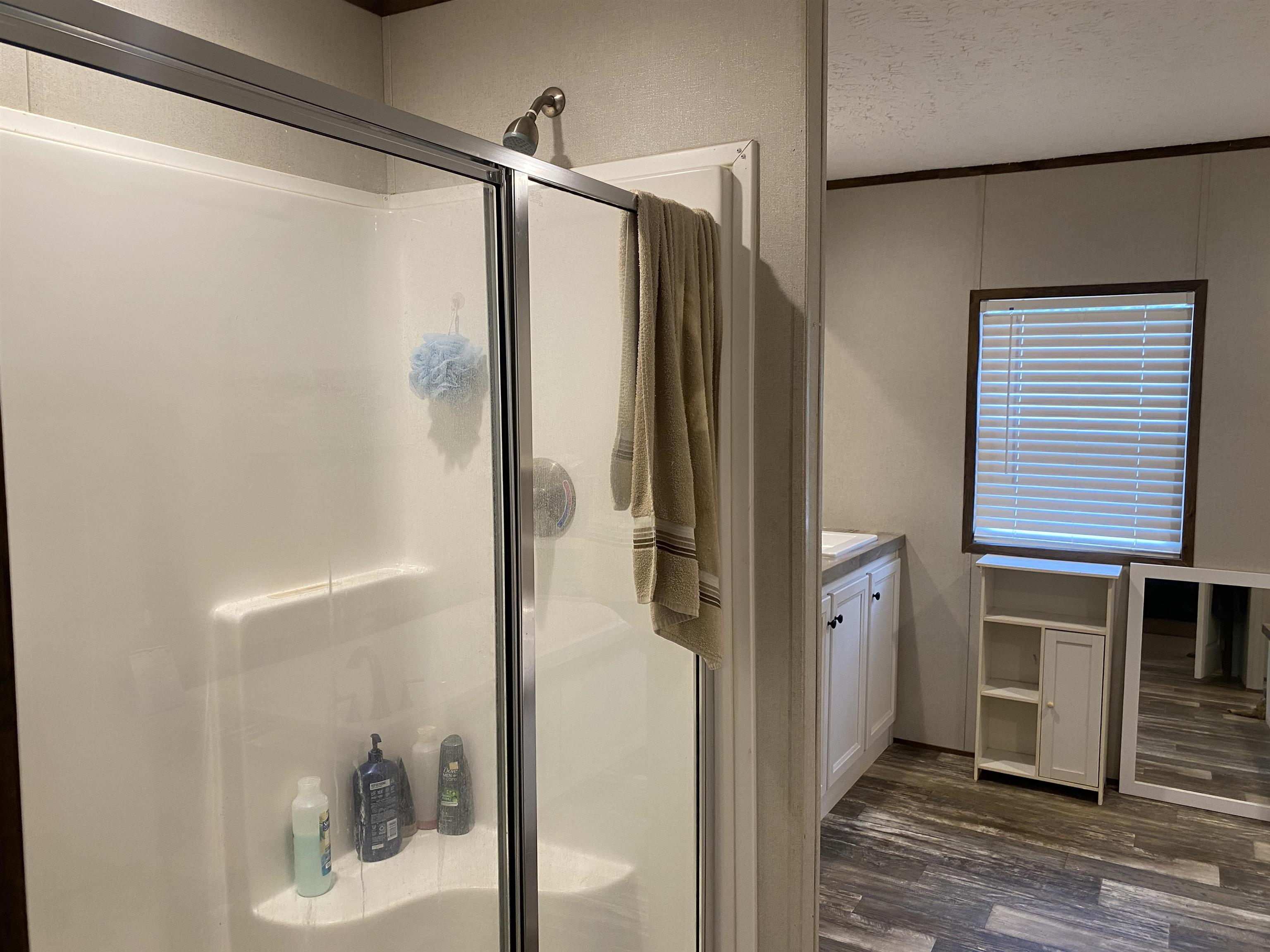 525 Sewell Bottom Road Adamsville, TN 38310 - Photo 19 of 37 a bathroom with a shower and a sink