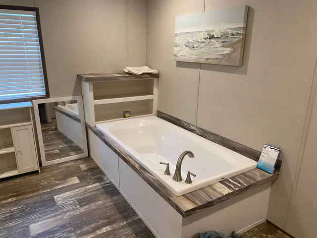 a view of a hallway with seating area