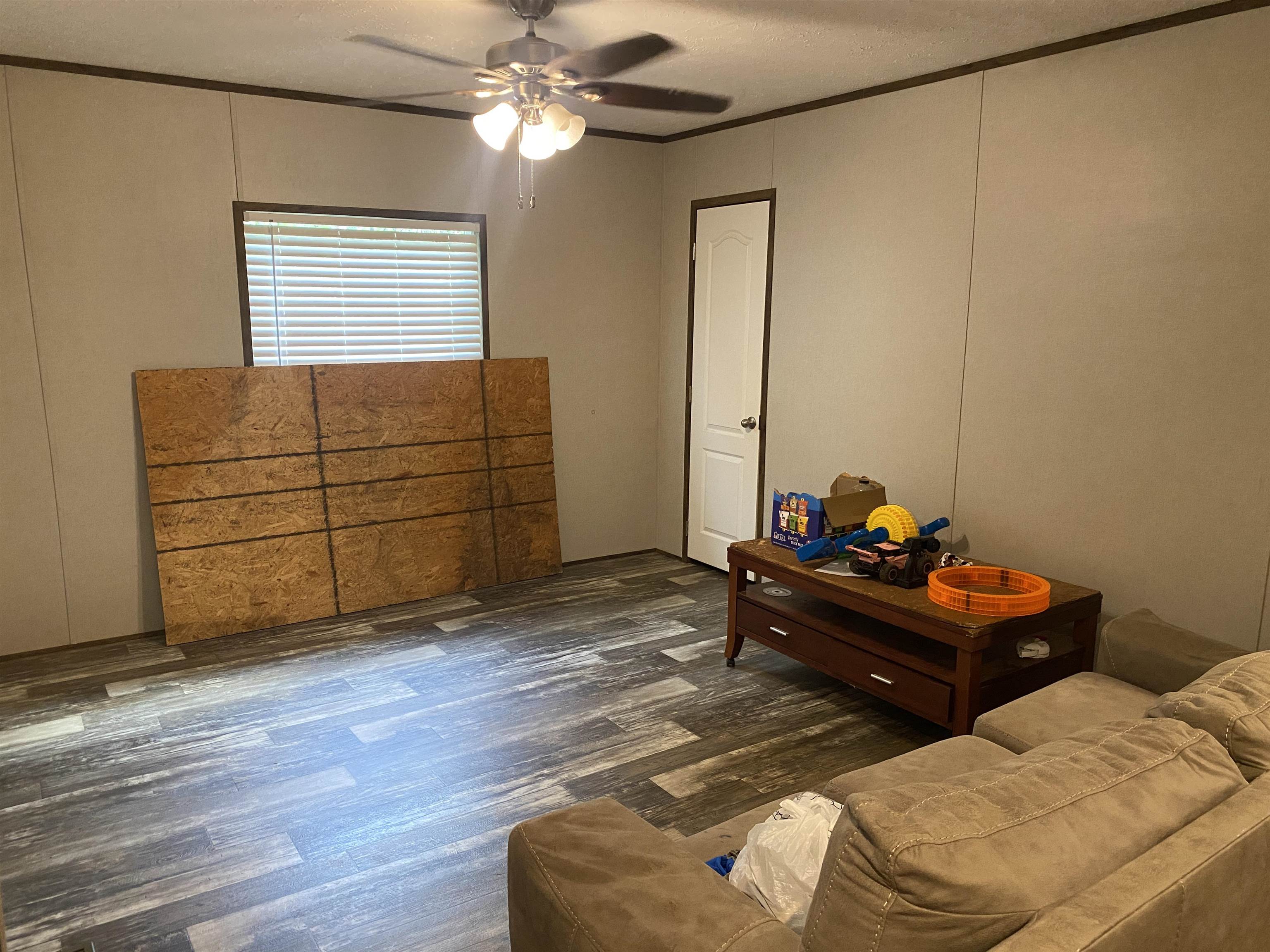 525 Sewell Bottom Road Adamsville, TN 38310 - Photo 22 of 37 a bed room with a bed and a window