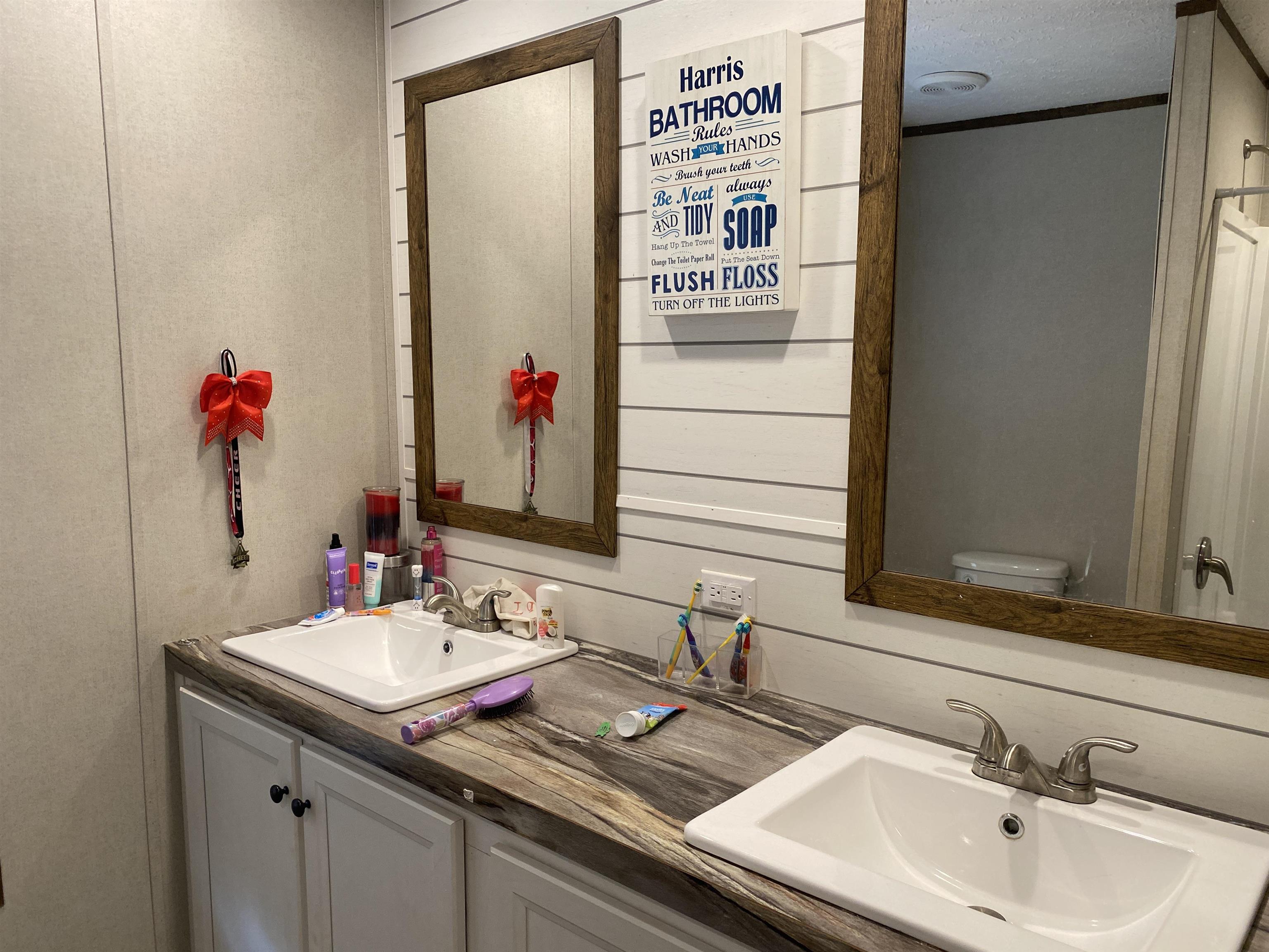 525 Sewell Bottom Road Adamsville, TN 38310 - Photo 27 of 37 a bathroom with a sink and a mirror