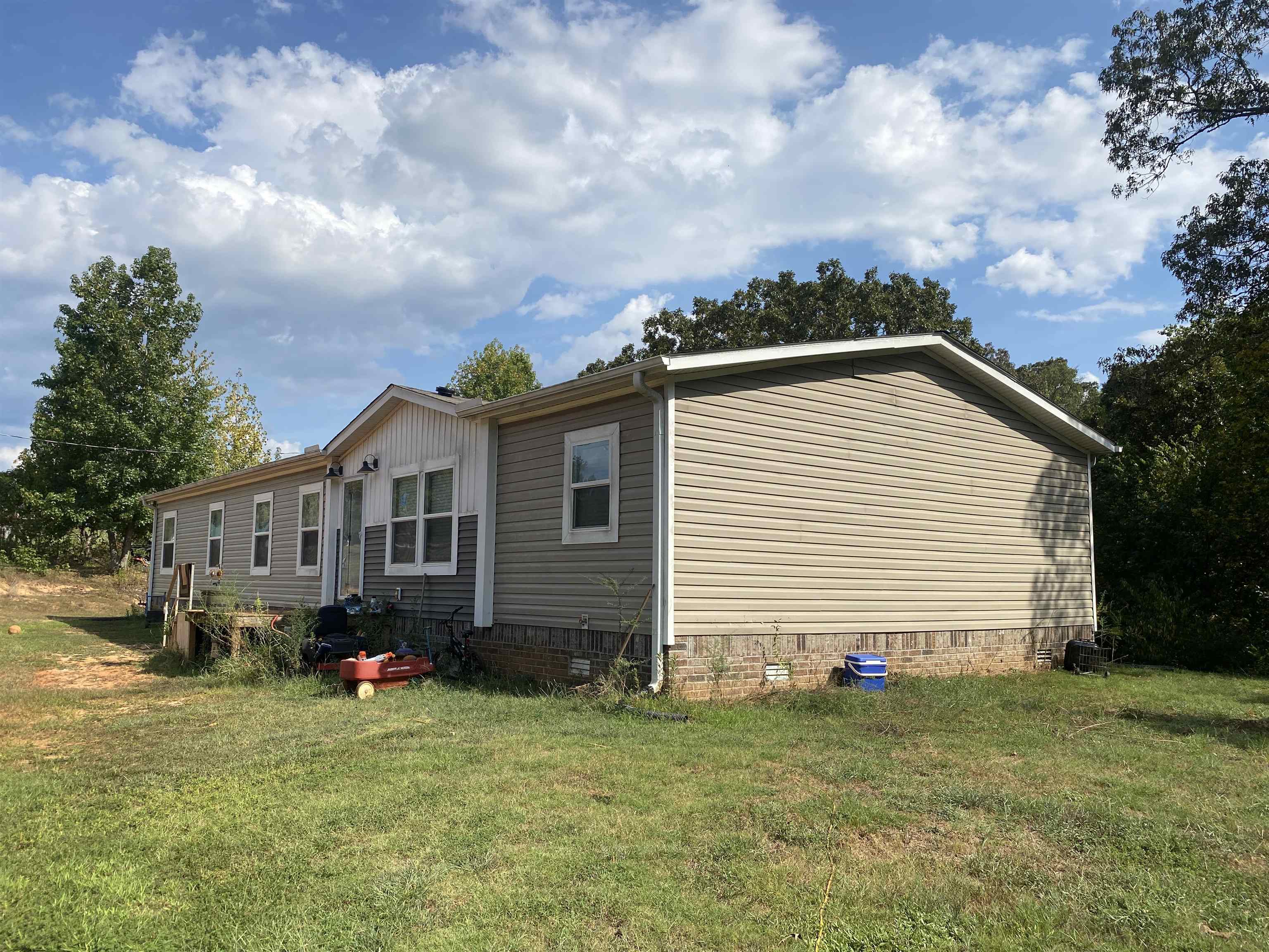 525 Sewell Bottom Road Adamsville, TN 38310 - Photo 29 of 37 a front view of a house with a garden