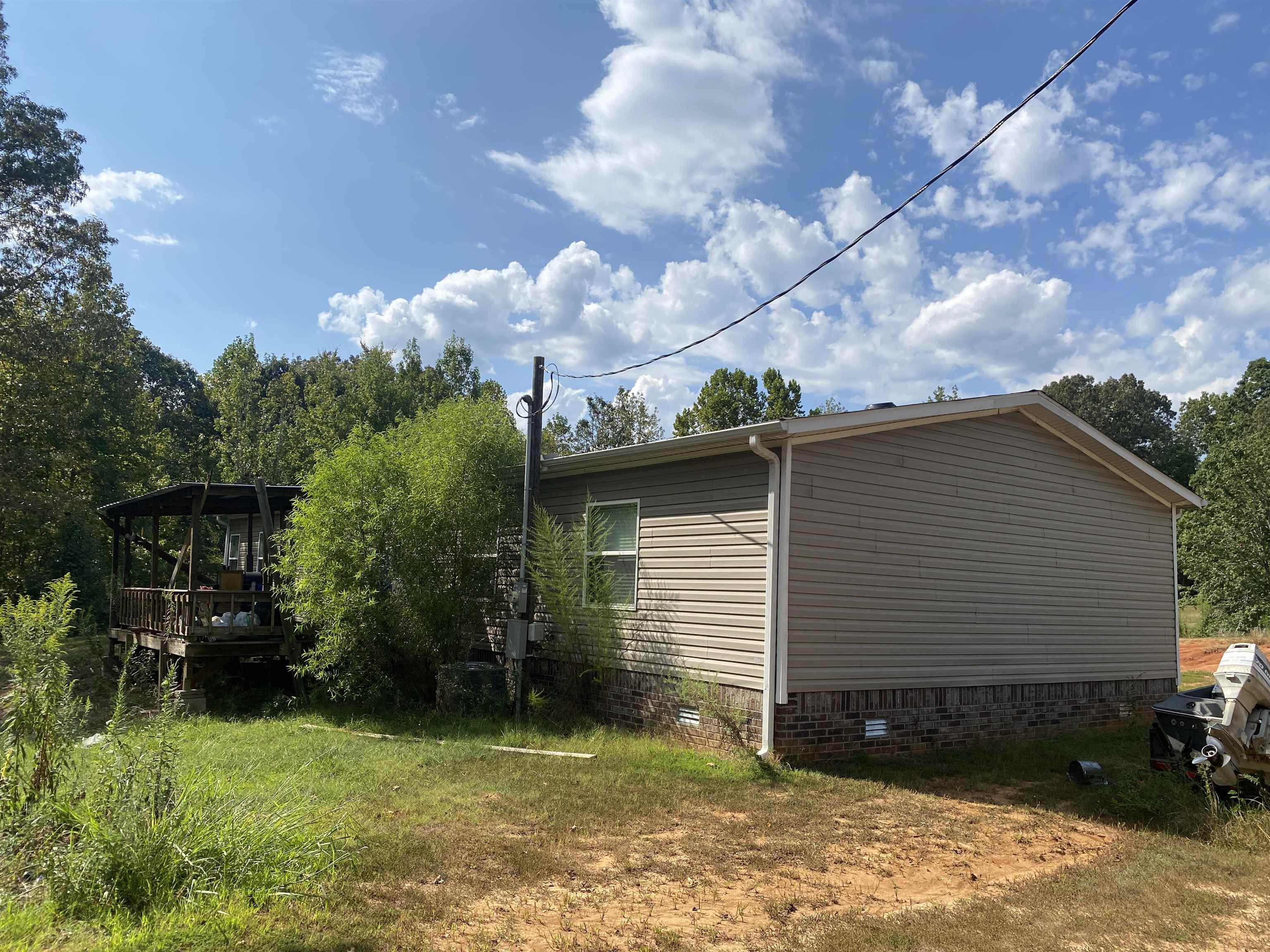 525 Sewell Bottom Road Adamsville, TN 38310 - Photo 30 of 37 a view of a house with a yard