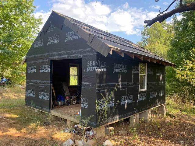 a front view of a house with parking