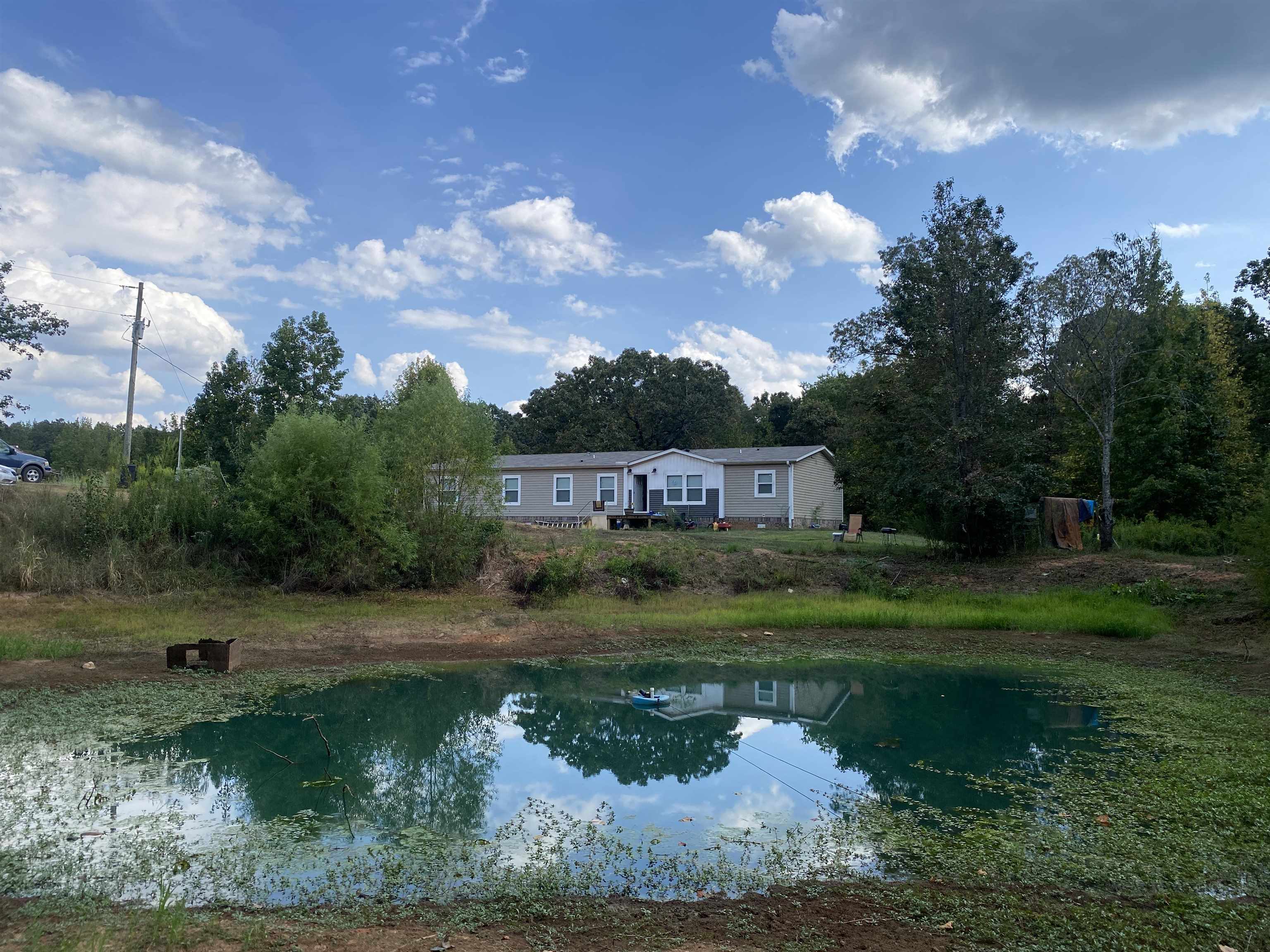 525 Sewell Bottom Road Adamsville, TN 38310 - Photo 35 of 37 a view of a house with a yard