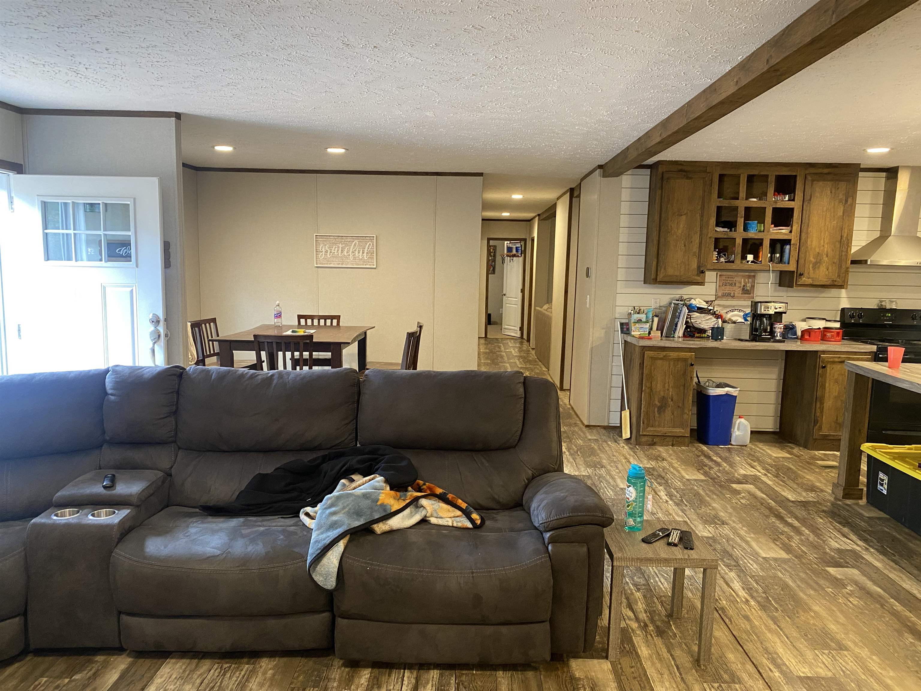 525 Sewell Bottom Road Adamsville, TN 38310 - Photo 6 of 37 a living room with furniture and a wooden floor