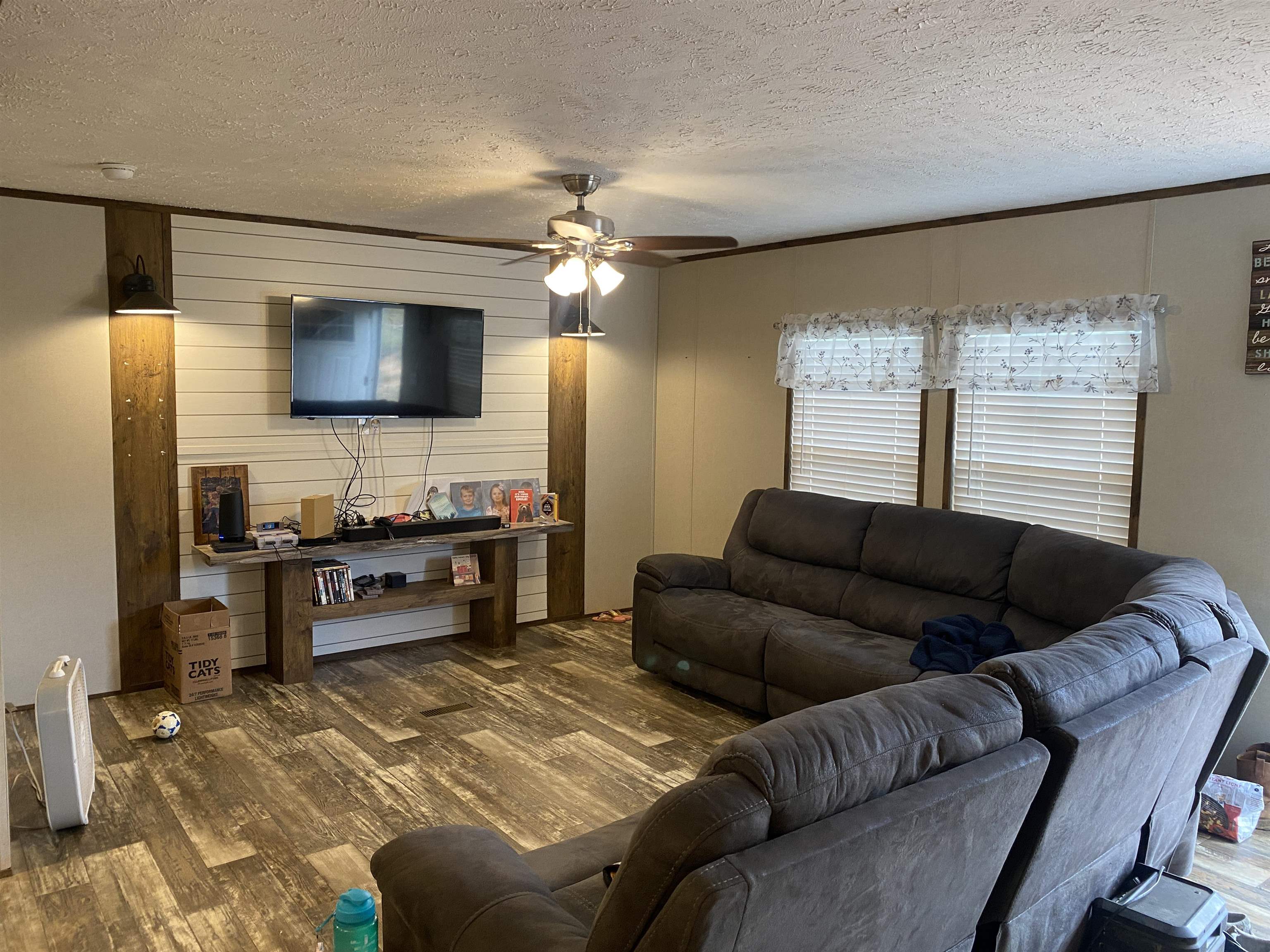 525 Sewell Bottom Road Adamsville, TN 38310 - Photo 7 of 37 a living room with furniture and a flat screen tv