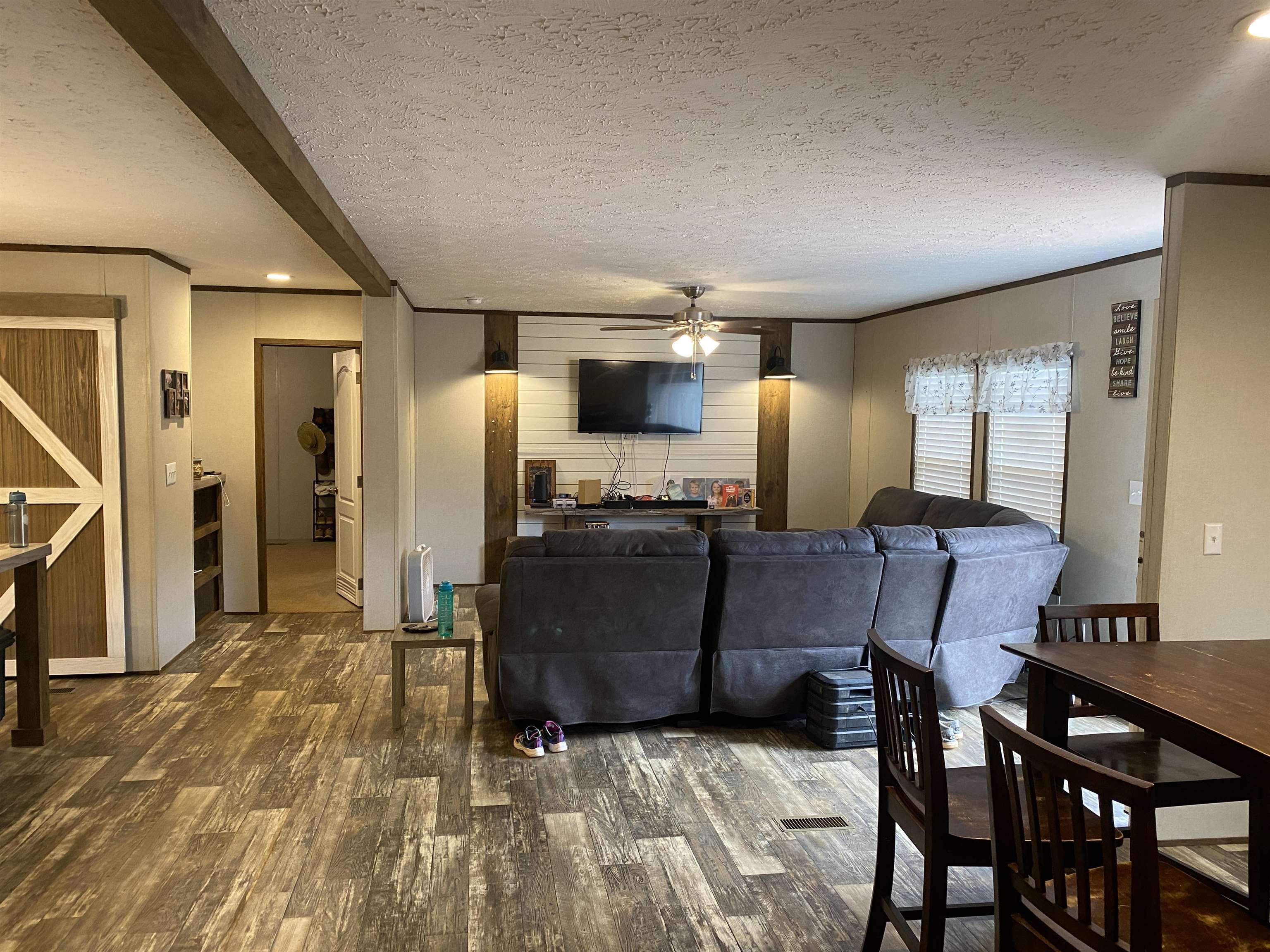 525 Sewell Bottom Road Adamsville, TN 38310 - Photo 9 of 37 a living room with furniture and a flat screen tv