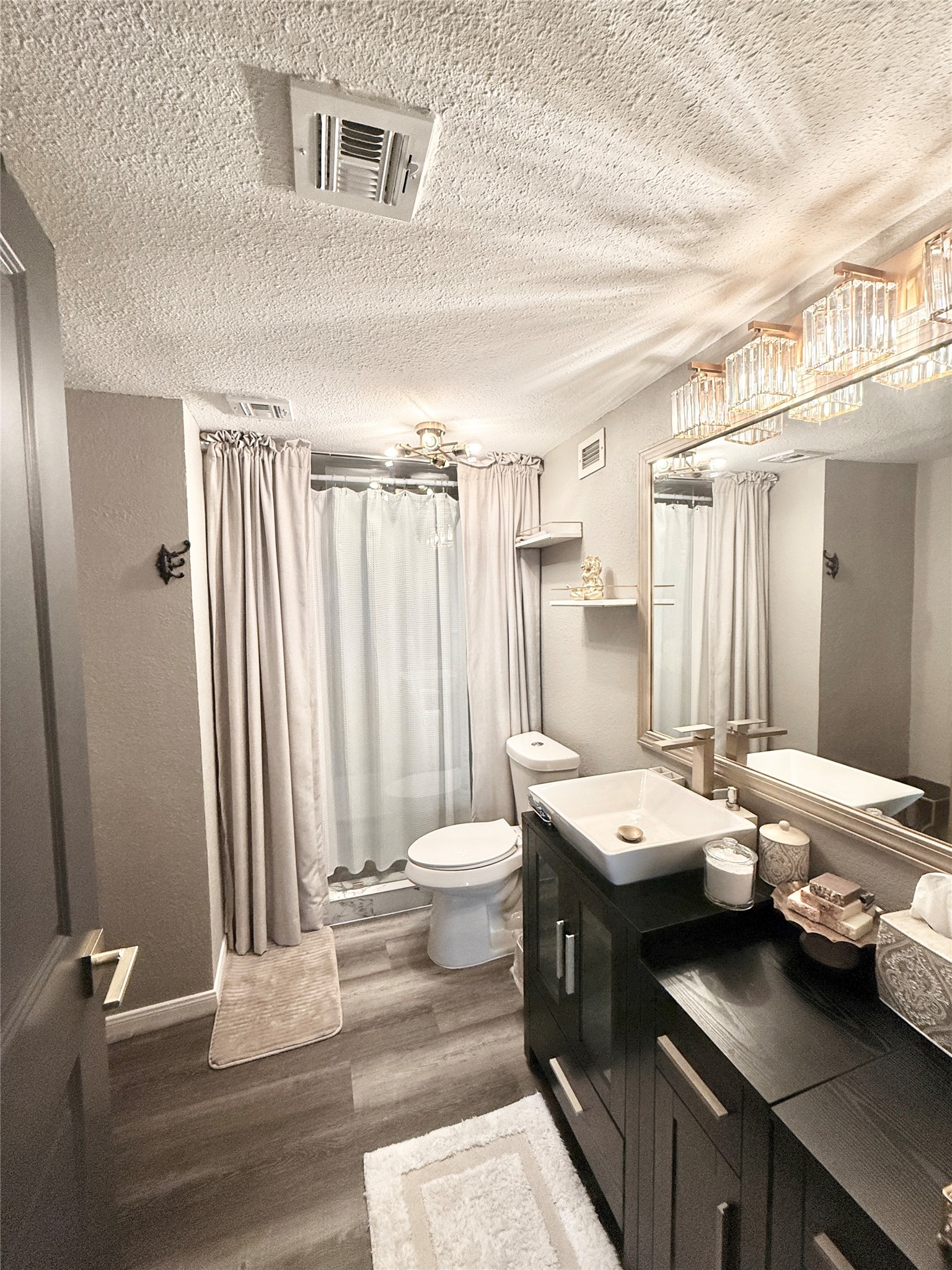2016 Main Street, Unit 1022 Houston, TX 77002 - Photo 23 of 48 a bathroom with a double vanity sink and a mirror