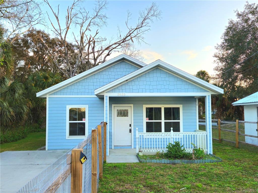 3633 Main Street Sanford, FL 32771 - Photo 1 of 31 a front view of house with yard and green space