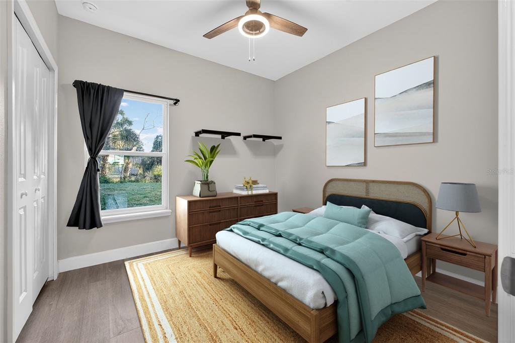3633 Main Street Sanford, FL 32771 - Photo 15 of 31 a bedroom with a bed and a window