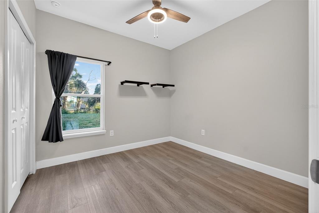 3633 Main Street Sanford, FL 32771 - Photo 16 of 31 wooden floor in an empty room with a window