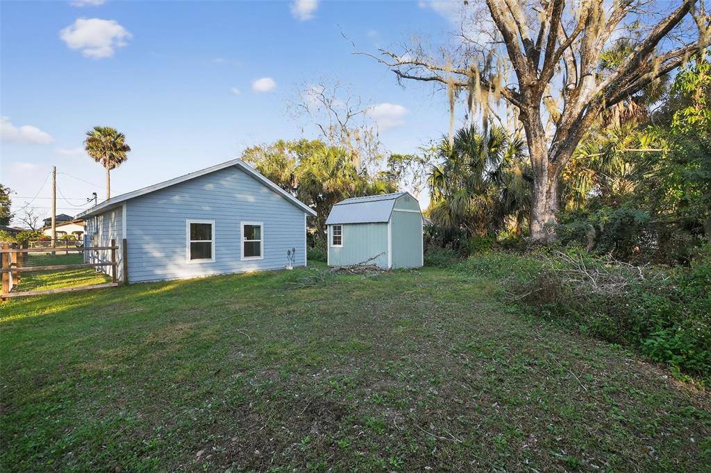3633 Main Street Sanford, FL 32771 - Photo 28 of 31 a view of a backyard with large trees